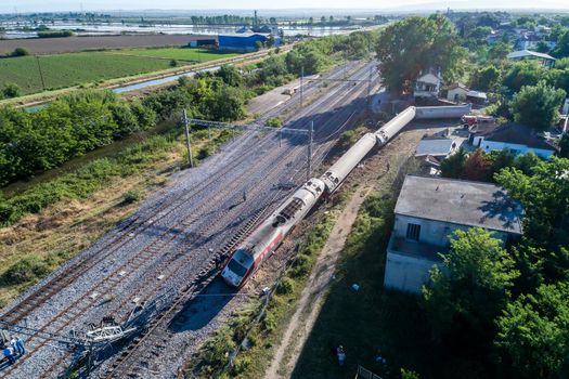 Thessaloniki, Greece - May 14, 2017: Train accident at Adendro, almost 40km west of Thessaloniki, with two confirmed dead among the passengers. The train crashed into a house after derailing.