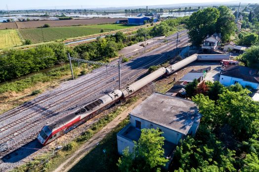 Thessaloniki, Greece - May 14, 2017: Train accident at Adendro, almost 40km west of Thessaloniki, with two confirmed dead among the passengers. The train crashed into a house after derailing.