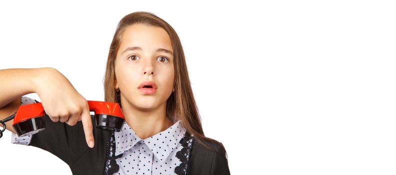 teenage girl talking on red retro telephone closeup on white background
