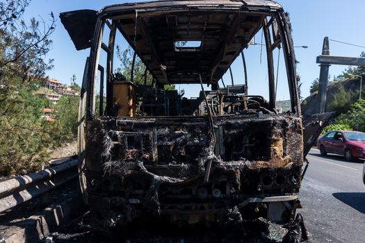 Thessaloniki, Greece - June 25, 2017: A tourist bus got fire and burned completely on the peripheral road of Thessaloniki. Passengers have been taken safely and harmless