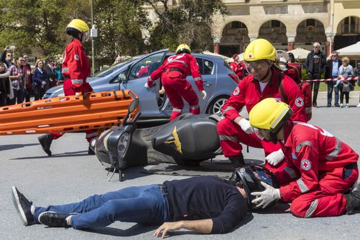 Thessaloniki , Greece - April 9, 2017: First aid, victim liberation in an car accident and helmet removal demonstration by the Hellenic Red Cross rescue team