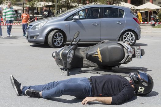 Thessaloniki , Greece - April 9, 2017: First aid, victim liberation in an car accident and helmet removal demonstration by the Hellenic Red Cross rescue team