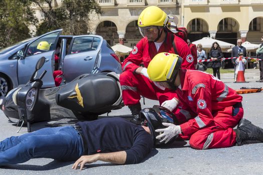 Thessaloniki , Greece - April 9, 2017: First aid, victim liberation in an car accident and helmet removal demonstration by the Hellenic Red Cross rescue team