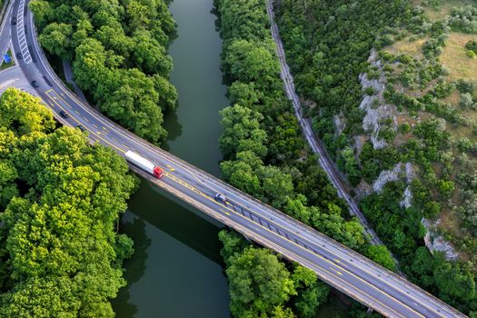 Aerial view of the bridge and the road over the river Pinios in the green valley of Tempe in Greece