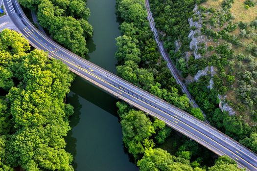 Aerial view of the bridge and the road over the river Pinios in the green valley of Tempe in Greece