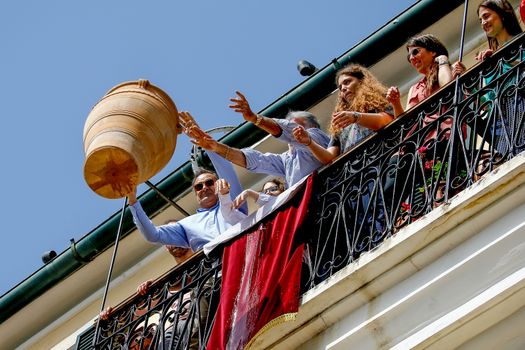 Corfu, Greece - April 27, 2019: Corfians throw clay pots from windows and balconies on Holy Saturday to celebrate the Resurrection of Christ