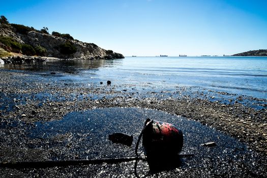 Salamina, Athens, Greece - Sept 13, 2017:Oil, leaked from a sinked ship, come ashore in Salamina Island near Athens, after an old tanker sank close to Salamis island  