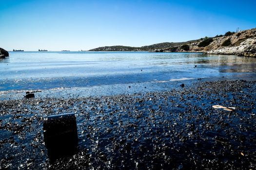 Salamina, Athens, Greece - Sept 13, 2017:Oil, leaked from a sinked ship, come ashore in Salamina Island near Athens, after an old tanker sank close to Salamis island  