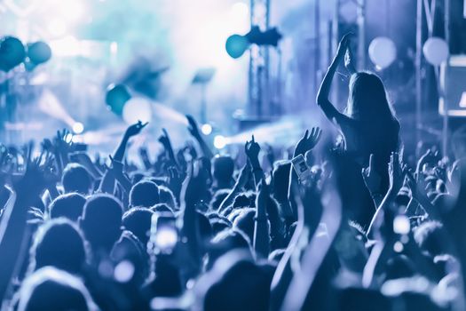 Hand with a smartphone records live music festival, Taking photo of concert stage, live concert, music festival, happy youth, luxury party, landscape exterior