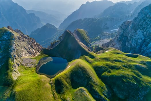 Drakolimni of Tymfi. The lake resides at an altitude of 2050m above sea, in Vikos National Park in Greece. At 5 hours walking distance from the village of Papingo, is a popular trekking destination 