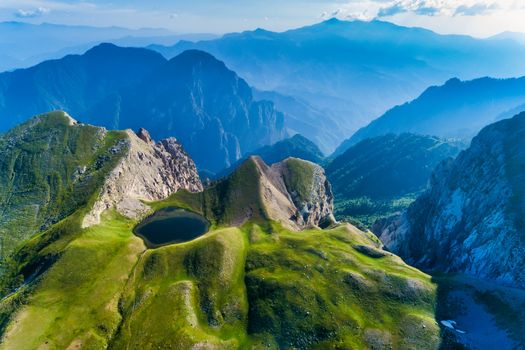 Drakolimni of Tymfi. The lake resides at an altitude of 2050m above sea, in Vikos National Park in Greece. At 5 hours walking distance from the village of Papingo, is a popular trekking destination 