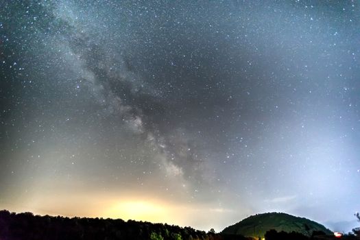 Milky Way over the Meteora, Greece. long exposure; Image contain noise, blur due to slow shutter speed.