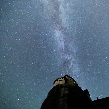 Milky Way over the Meteora, Greece. long exposure; Image contain noise, blur due to slow shutter speed.