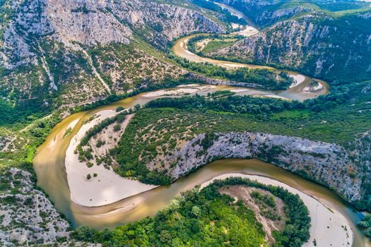 Aerial view of the river Nestos in Xanthi, Greece. The Nestos River forms on its long journey landscapes of unique beauty with rich forests, rare wetlands. favorite destination for canoe and kayak