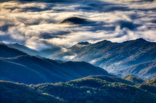 Panoramic view of mountains, autumn landscape with foggy hills at sunrise. Rhodope Mountains. Xanthi Thrace, Greece