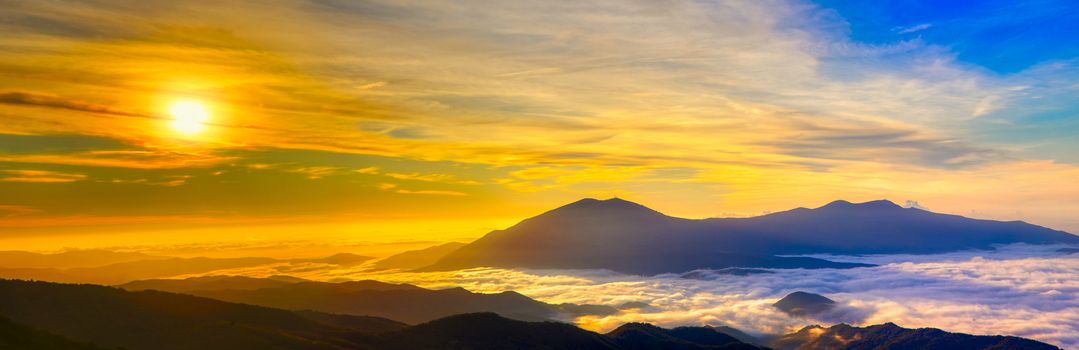 Amazing Sunrise Over Misty Landscape. Scenic View Of Foggy Morning Sky With Rising Sun Above Misty Forest. Rhodope Mountains. Xanthi Thrace, Greece. soft focus