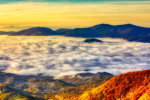 Amazing Sunrise Over Misty Landscape. Scenic View Of Foggy Morning Sky With Rising Sun Above Misty Forest. Rhodope Mountains. Xanthi Thrace, Greece. soft focus