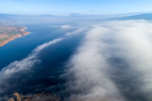 Aerial View. Flying over the clouds . Aerial camera shot. Landscape panorama.