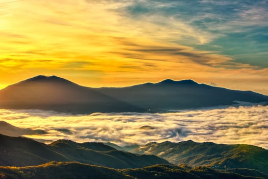 Amazing Sunrise Over Misty Landscape. Scenic View Of Foggy Morning Sky With Rising Sun Above Misty Forest. Rhodope Mountains. Xanthi Thrace, Greece