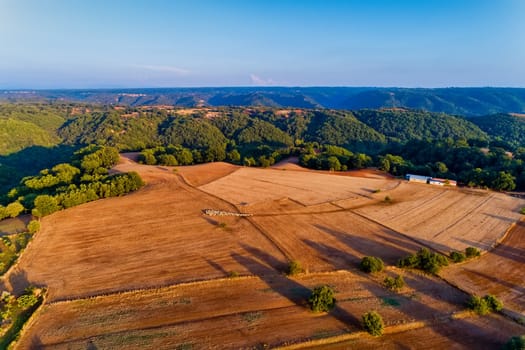 Beautiful rural scenery in mountains. agricultural fields with sheep. Aerial shot whith drone