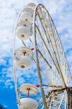 Ferris wheel on the pier at Blackpool against blue sky