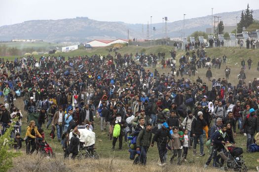 Thessaloniki, Greece - April 5, 2019: Hundreds of migrants and refugees gathered outside of a refugee camp in Diavata to walk until the Northern borders of Greece to pass to Europe.