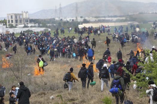 Thessaloniki, Greece - April 5, 2019: Hundreds of migrants and refugees gathered outside of a refugee camp in Diavata to walk until the Northern borders of Greece to pass to Europe.