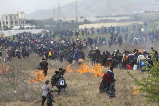 Thessaloniki, Greece - April 5, 2019: Hundreds of migrants and refugees gathered outside of a refugee camp in Diavata to walk until the Northern borders of Greece to pass to Europe.