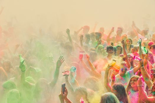 Thessaloniki, Greece - September 2, 2018: Crowds of unidentified people throw colour powder during the "Day of Colours" annual event.