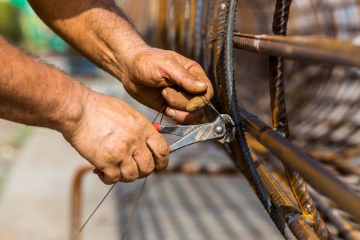 construction workers steel tie.Selective focus. Very shallow Depth of Field, for soft background.