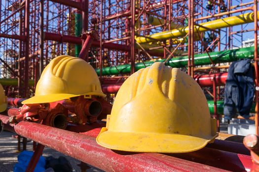 yellow hardhat on construction site