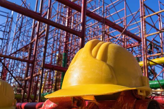 yellow hardhat on construction site