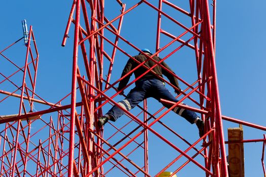 Construction workers building a new structure in city