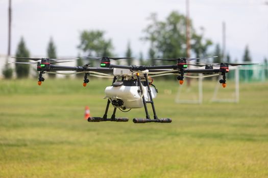 Thessaloniki, Greece - June 21, 2018: Professional agriculture drone on the green field during the test flight