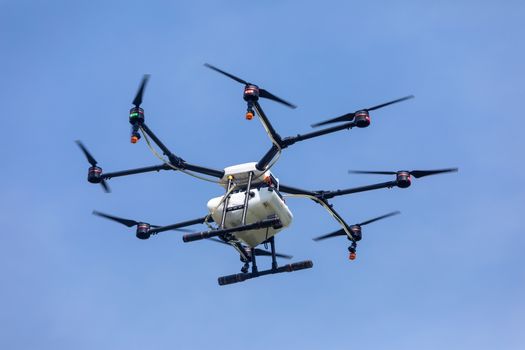 Thessaloniki, Greece - June 21, 2018: Professional agriculture drone on the green field during the test flight