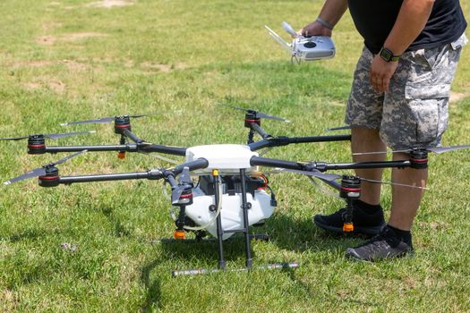 Thessaloniki, Greece - June 21, 2018: Professional agriculture drone on the green field during pre-flight preparation