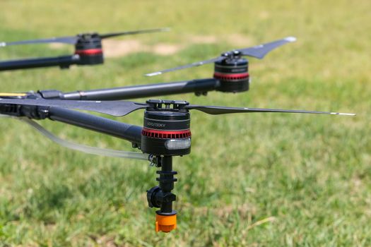 Thessaloniki, Greece - June 21, 2018: Professional agriculture drone on the green field during pre-flight preparation