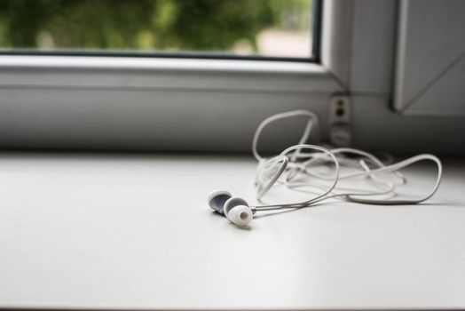 White headphones on a white background