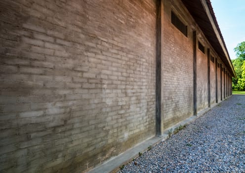 Big and dense wall of building made by concrete and brick