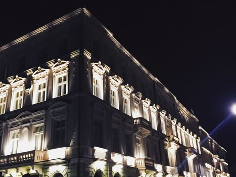 Exterior facade of classic building in the European city at night, architecture and design detail