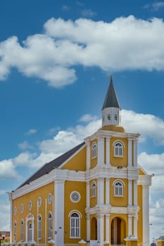 An old yellow and white plaster church on Curacao