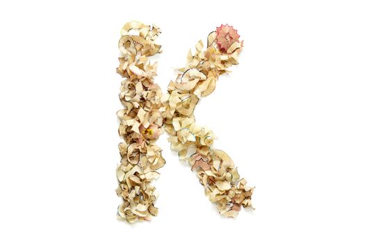 Letter K made from coloured pencil shavings for use in your design.