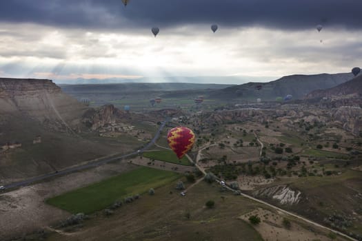 A view of the colorful balloons that fly over the valleys of Cappadocia at dawn. Turkey.