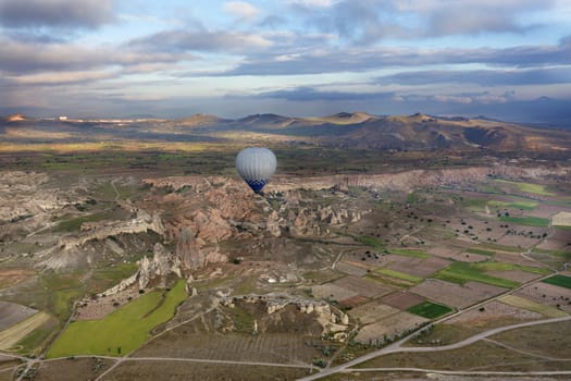 A view of the balloon that fly over the colorful valleys of Cappadocia at dawn. Turkey.