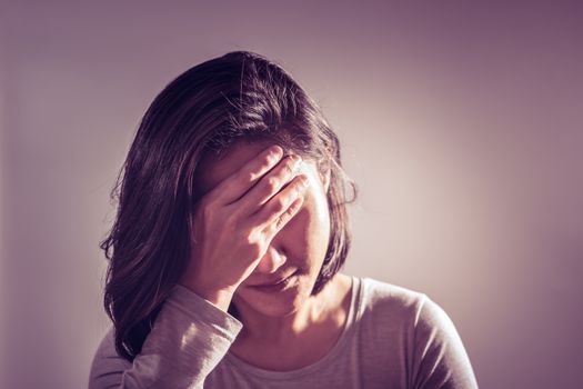 underexpose of the headache women hand hold the forehead, medicine recovery concept