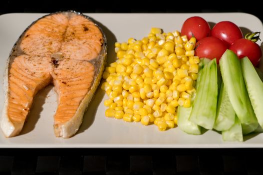 grilled fish salmon fillet with fresh vegetable, food and vegetable concept