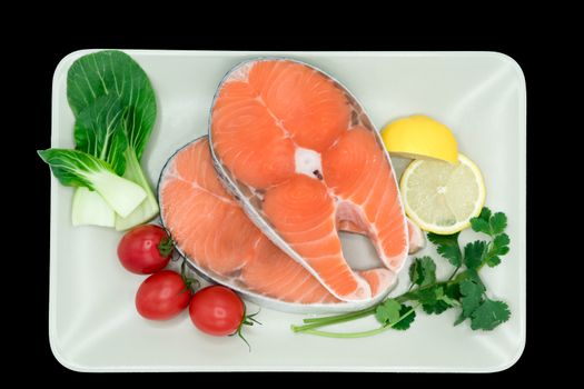 raw salmon steak with vegetable on plate, food and vegetable concept