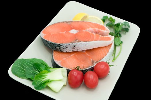 raw salmon steak with vegetable on plate, food and vegetable concept