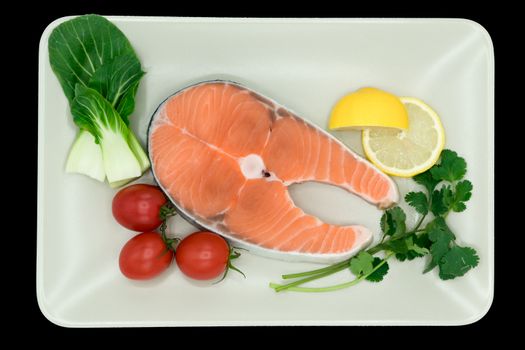 raw salmon steak with vegetable on plate, food and vegetable concept