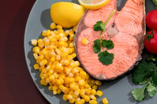 closed-up grilled fish salmon fillet with fresh vegetable, food and vegetable concept
